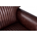 Sillón de piel marrón de estilo vintage con ruedas metálicas